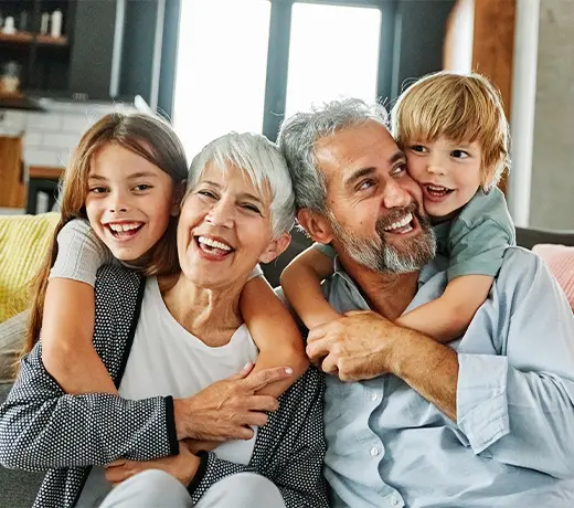 Portrait of grandparents and grandchildren having fun together at home annuities