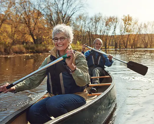 smiling seniors kayaking how to plan for retirement